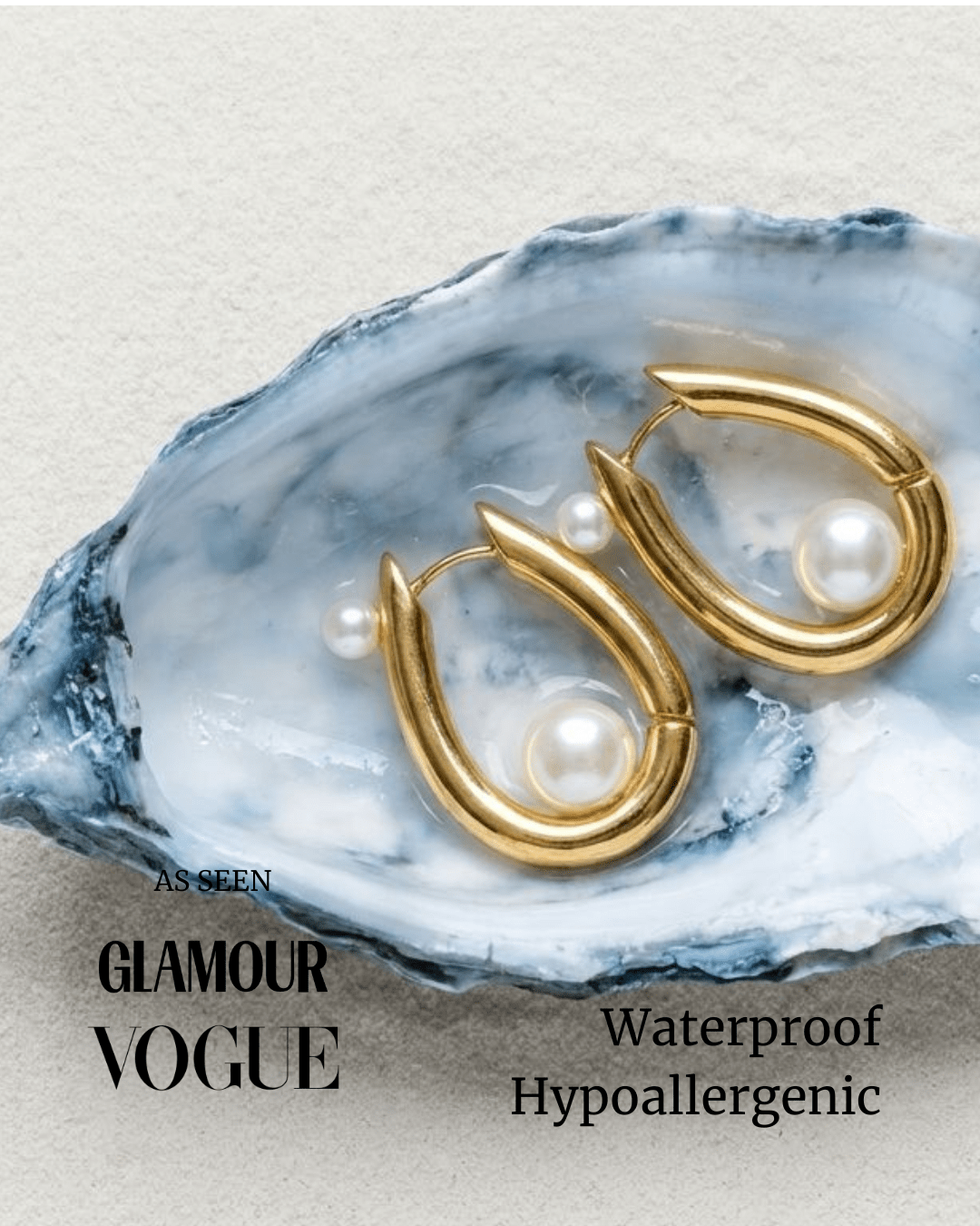 Gold-tone huggie hoop earrings with white pearls on blue stone