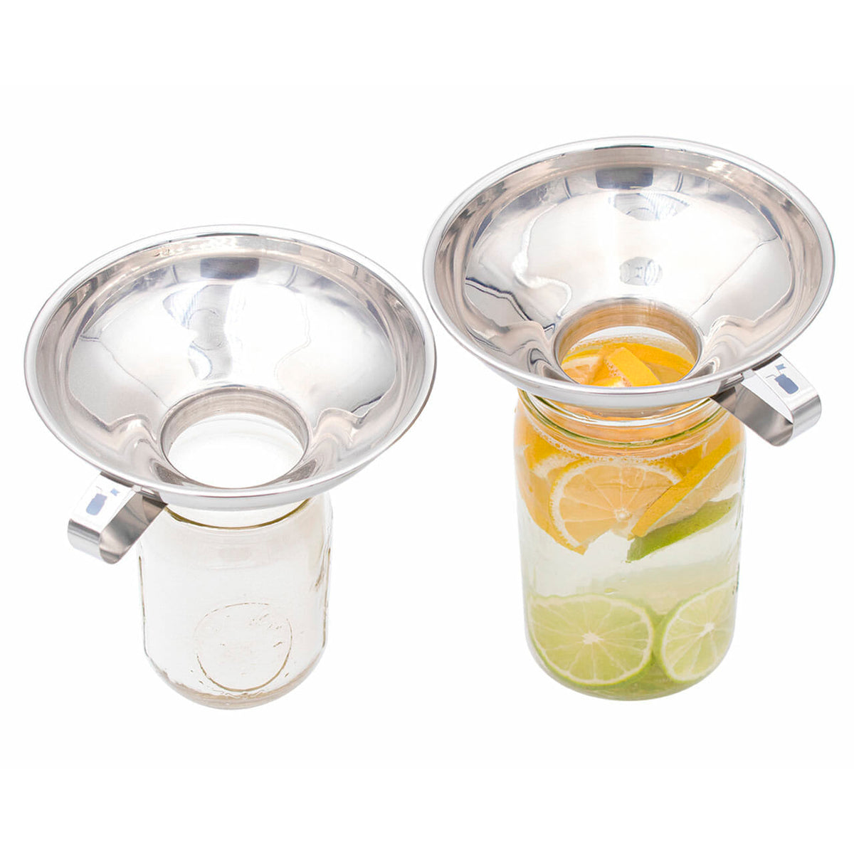 Stainless steel canning funnel with spout, holding lime slices in mason jar