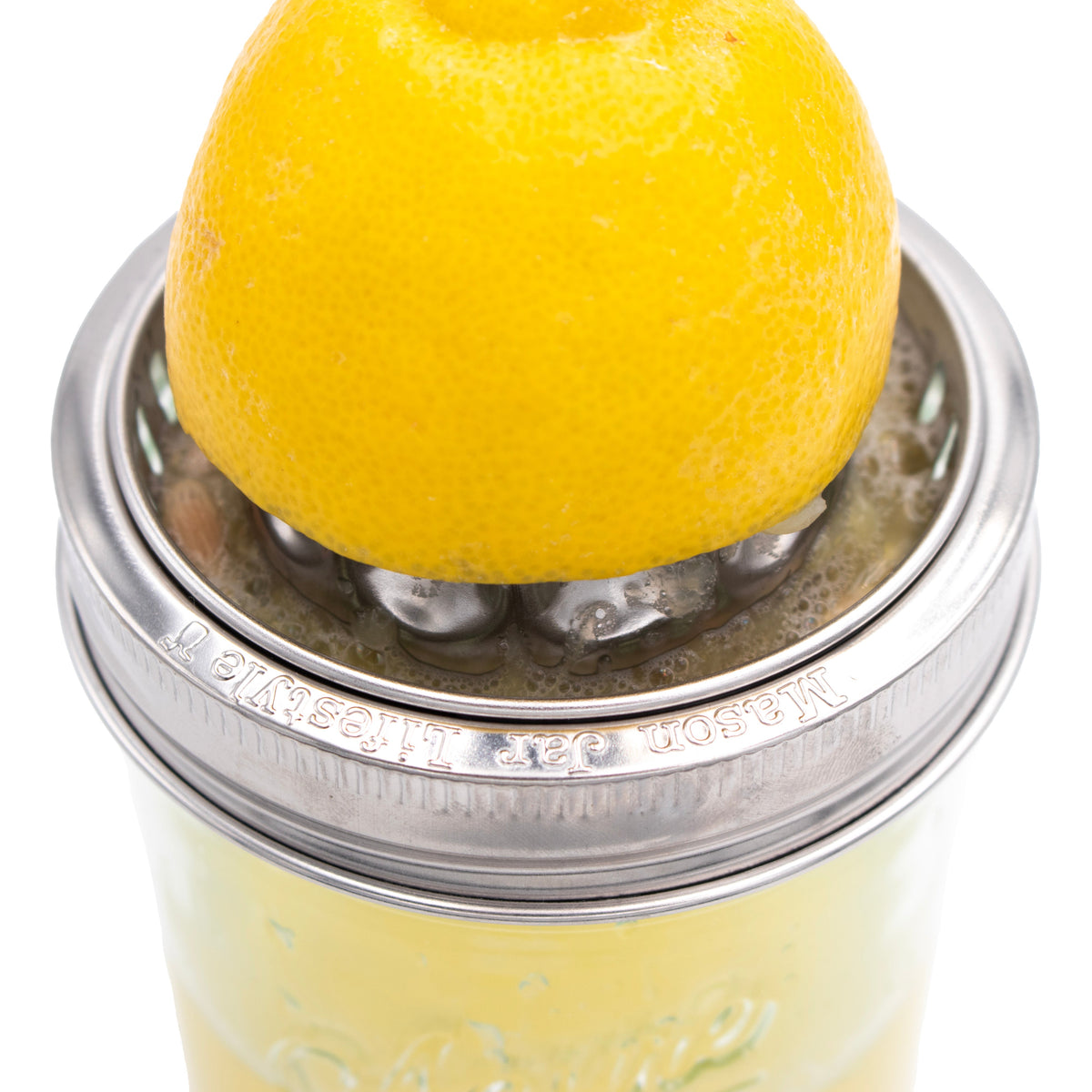Stainless steel wide-mouth juicing lid with raised rim and embossed text