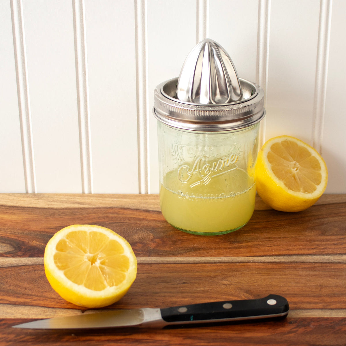 Stainless steel citrus juicing lid for wide-mouth mason jars with press cone