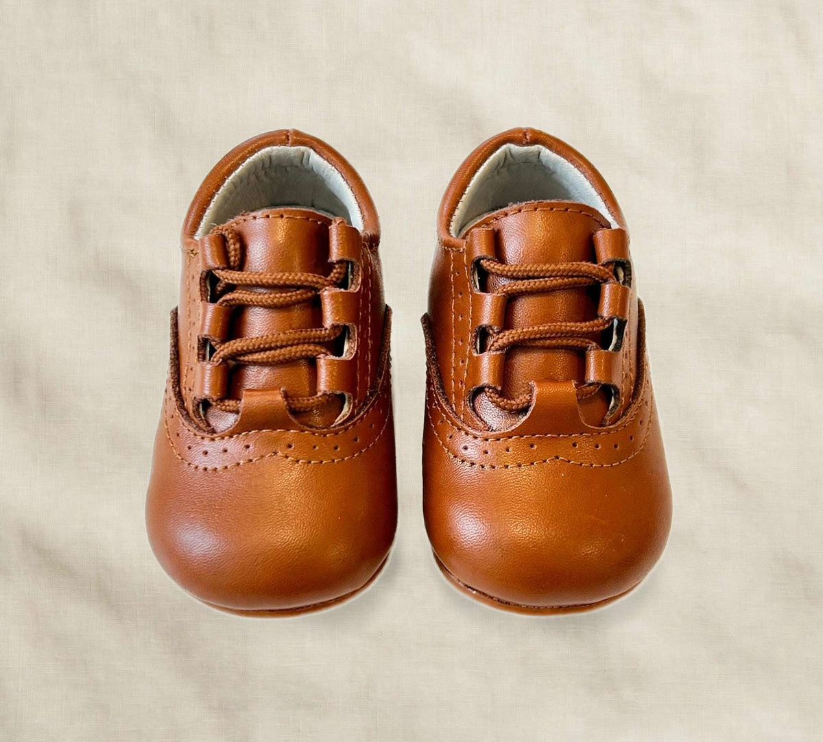 Kids lace-up dress shoes with wide toe box, tan-brown leather, front view