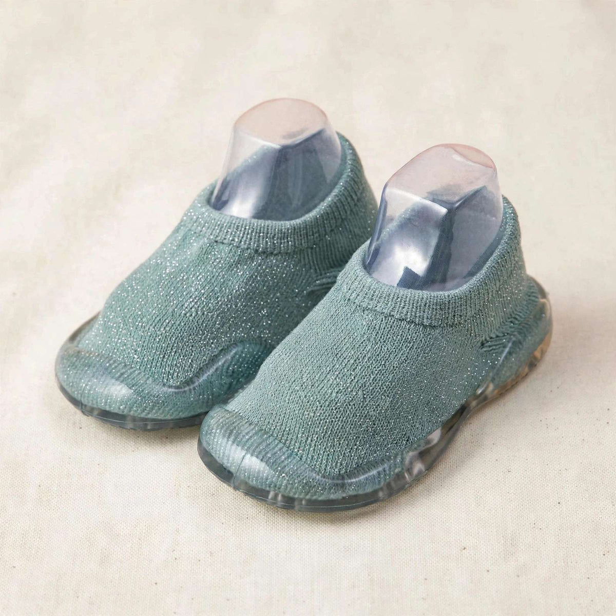 Teal knit sock shoes for babies with clear sole and cushioned slip-on fit