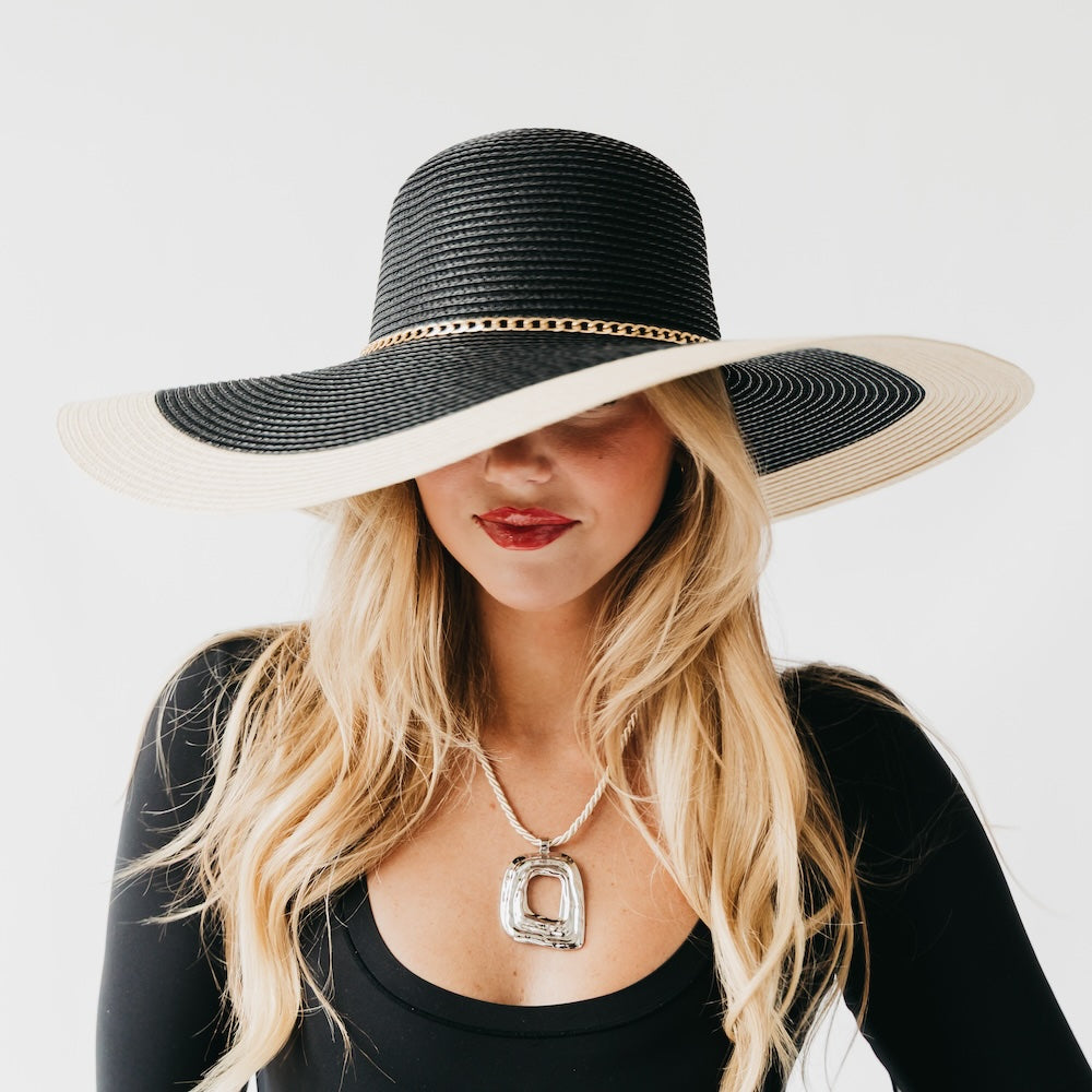 Two-tone wide floppy sun hat, black crown with tan brim and gold chain band