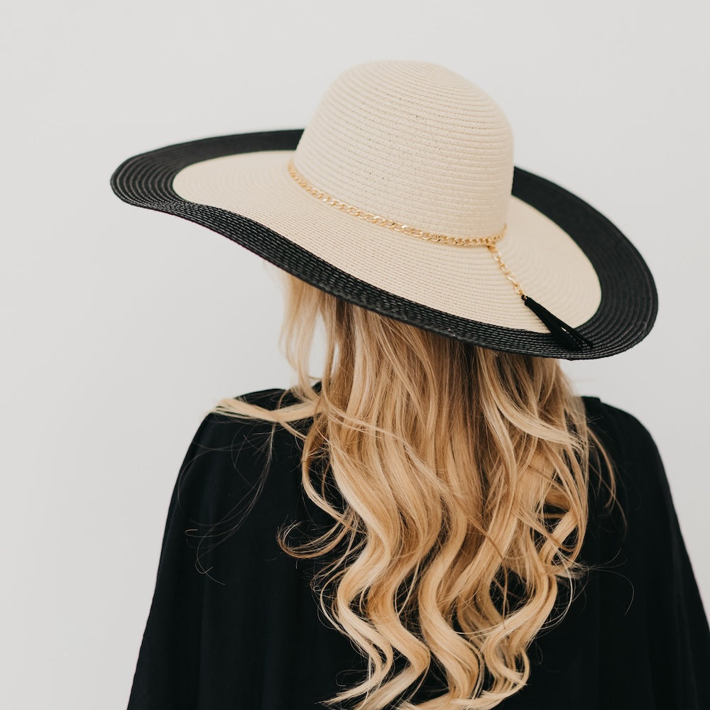 Two-tone wide floppy sun hat with gold chain band, tan crown and black brim