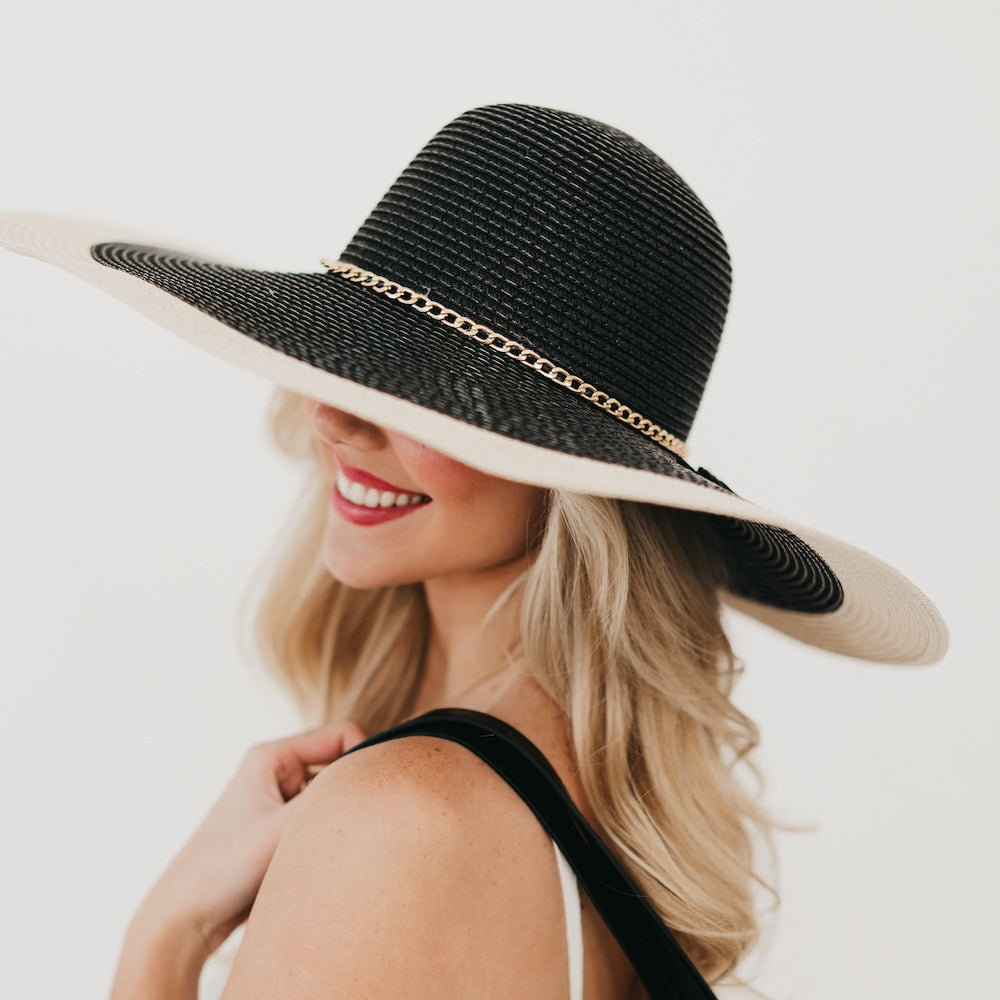Two-tone wide floppy sun hat with gold chain band, black crown and tan wide brim