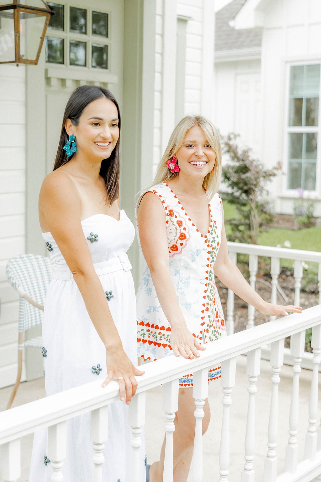 Turquoise statement earrings on two models, floral drop style