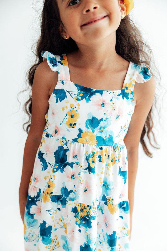 White sleeveless ruffle maxi dress with blue-yellow floral print, square neckline
