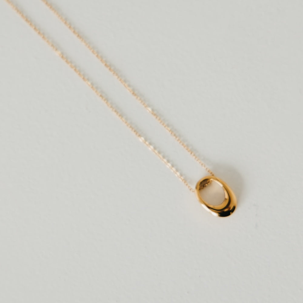 Gold open oval pendant on chain, mini size