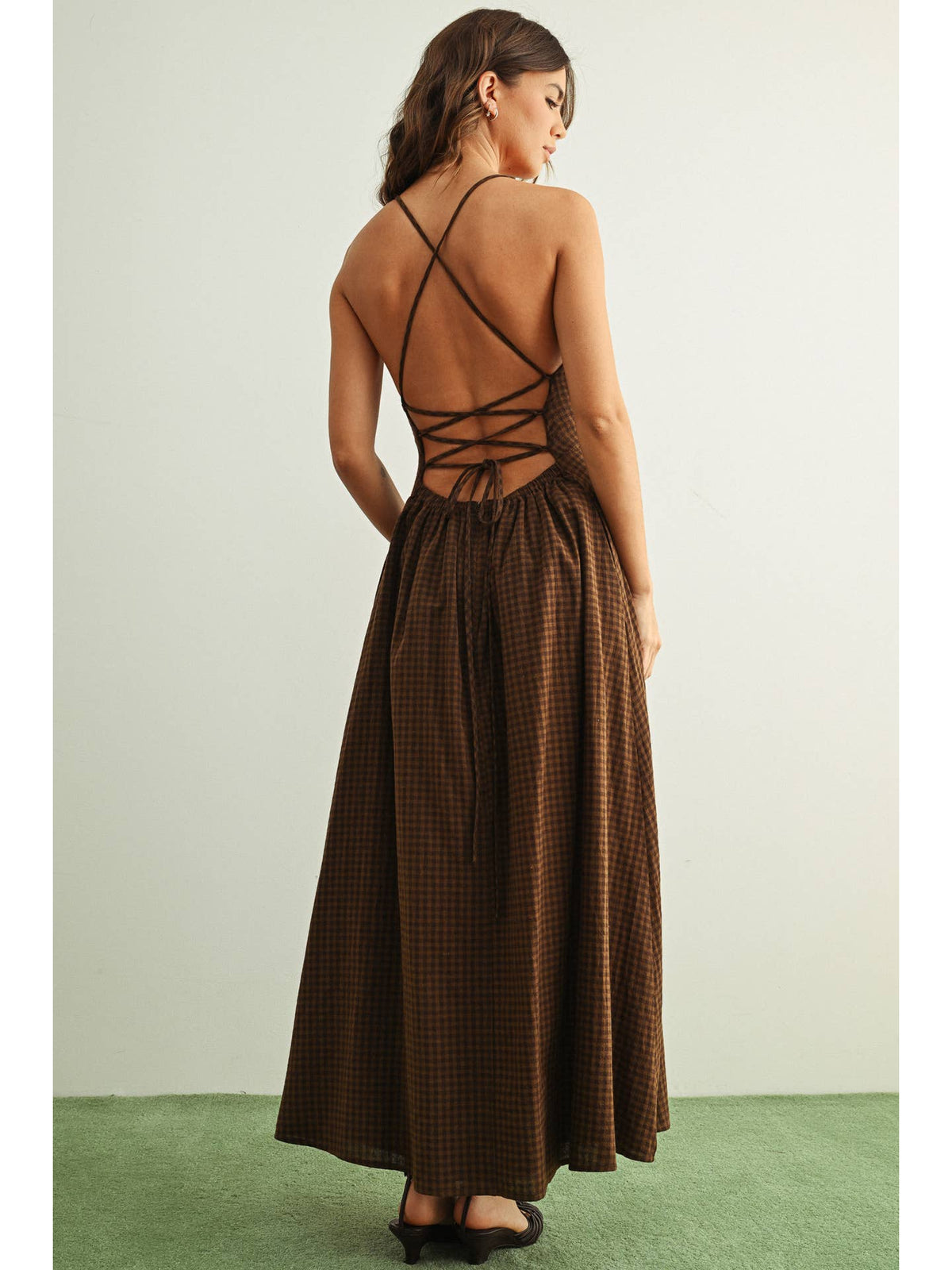 Chocolate gingham maxi dress with a lace-up open back and a flowing full-length skirt