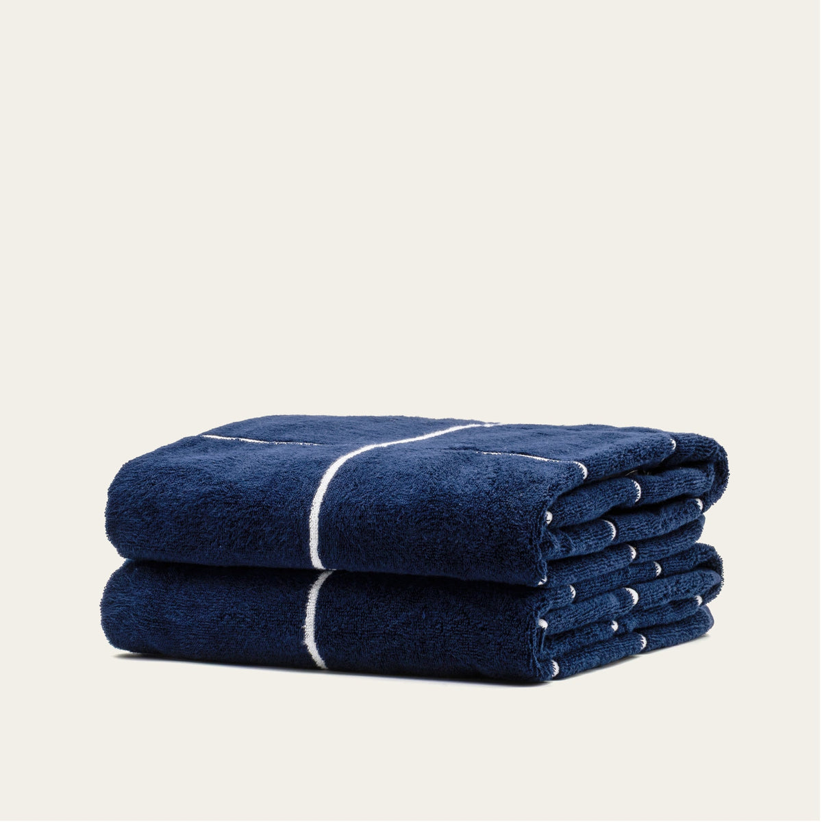 Miramar Australian cotton towel, navy with white stripe band, neatly folded pair