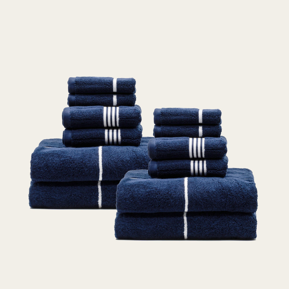 Miramar Australian cotton towels, navy with white stripe bands, two stacked sets