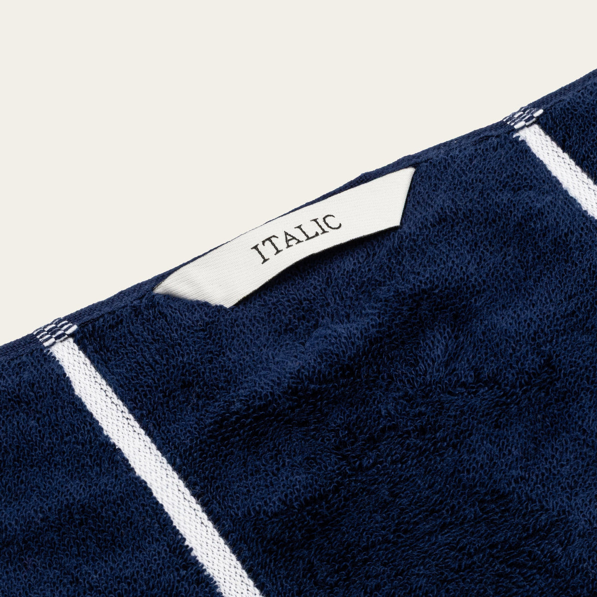 Miramar Australian cotton towel detail, navy with white border stripe and ITALIO label
