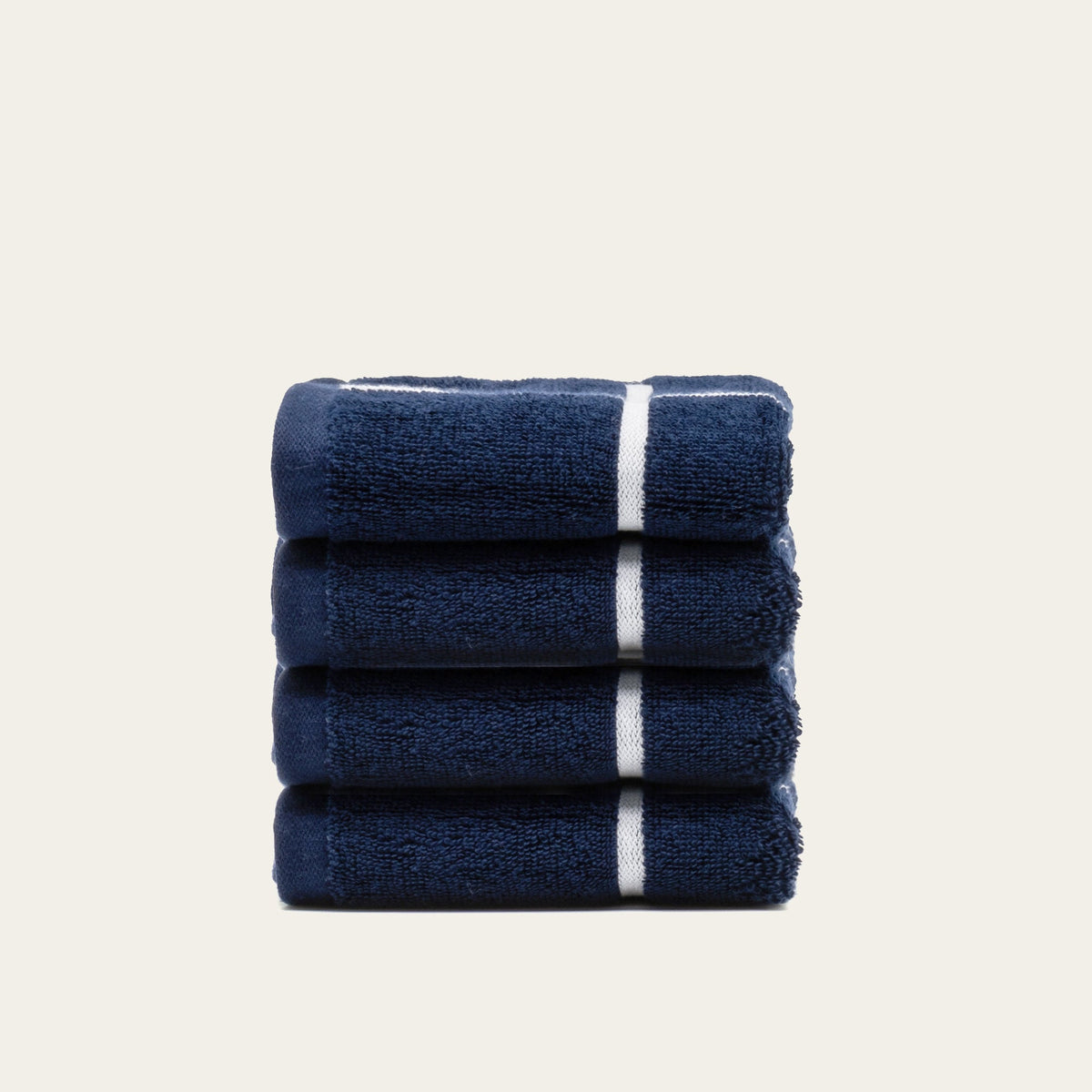 Miramar Australian cotton towels, navy with white stripe bands, folded stack