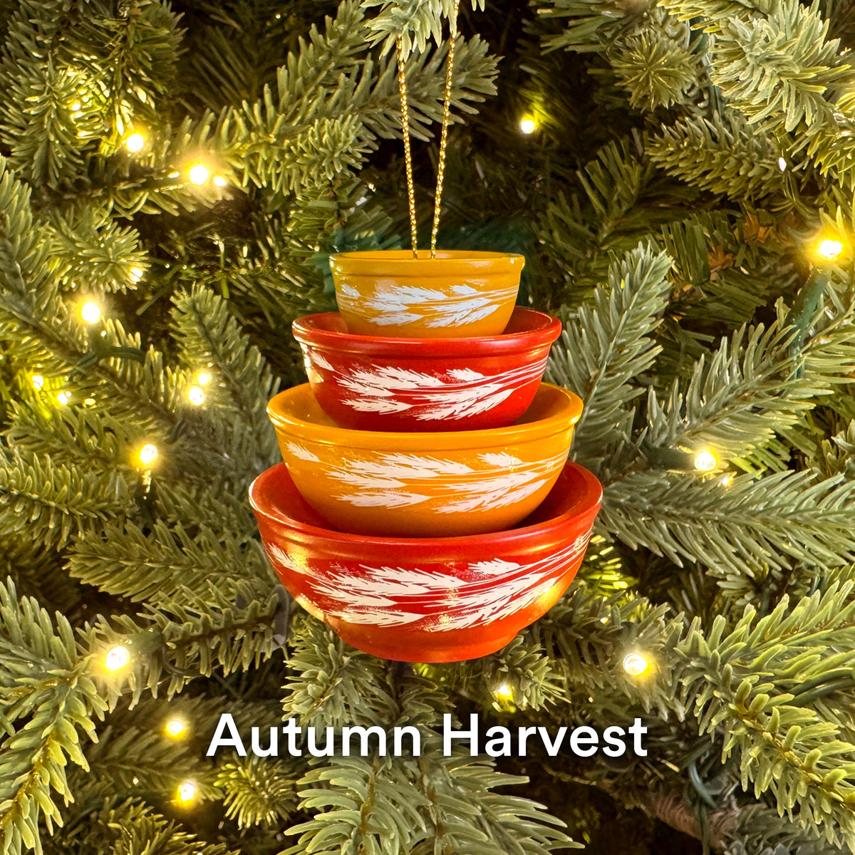 Mini Pyrex-inspired bowl ornaments, stacked orange and yellow with wintery white design