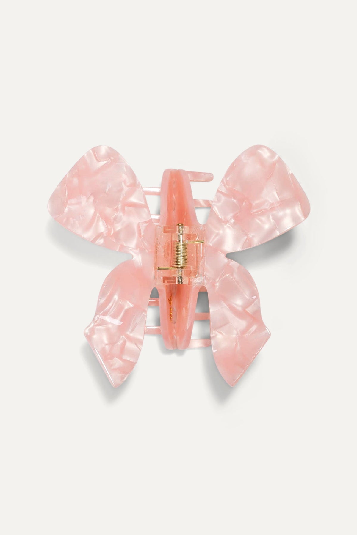 Pink translucent bow hair claw with center hinge, flat front view