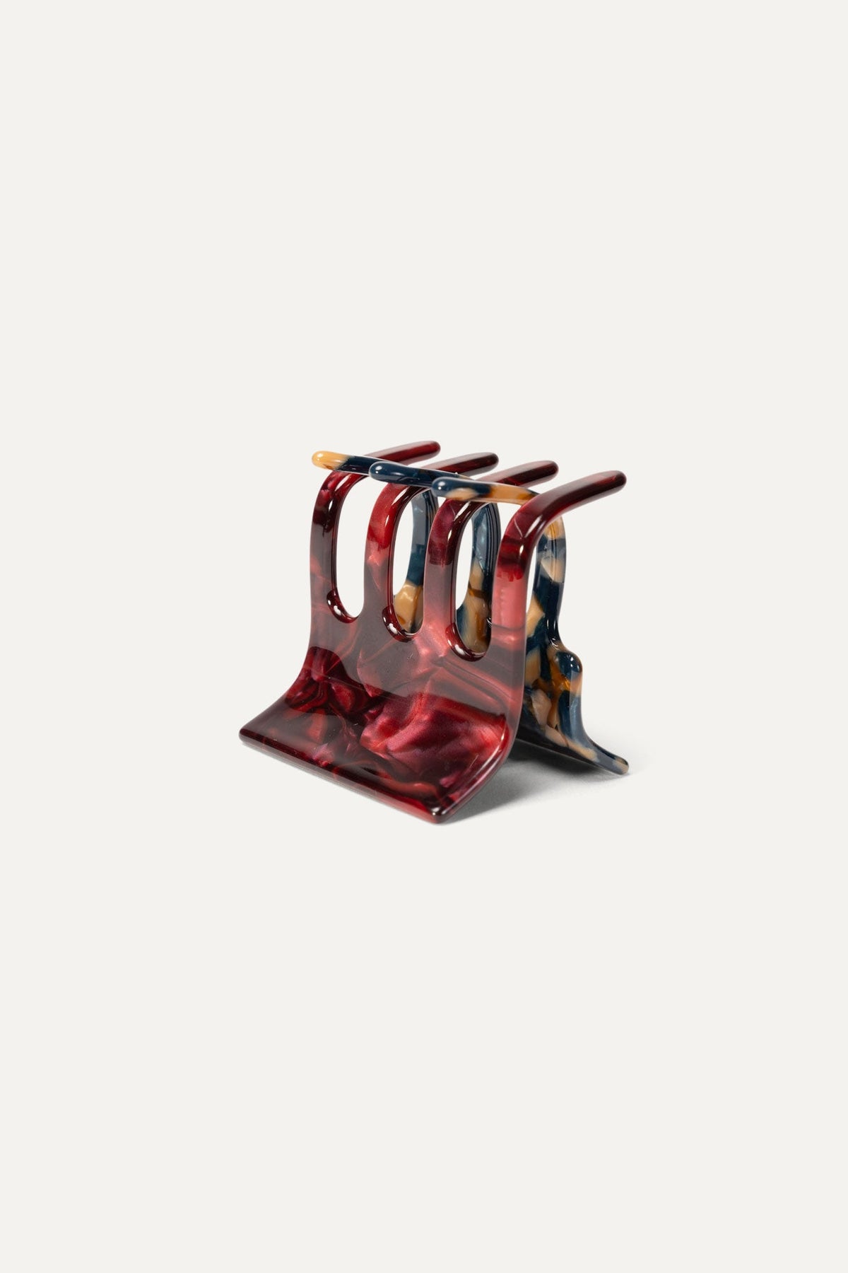 Mini hair claw clip with red marbled resin, multi-prong design