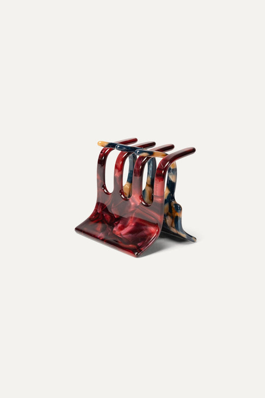 Mini hair claw clip with red marbled resin, multi-prong design