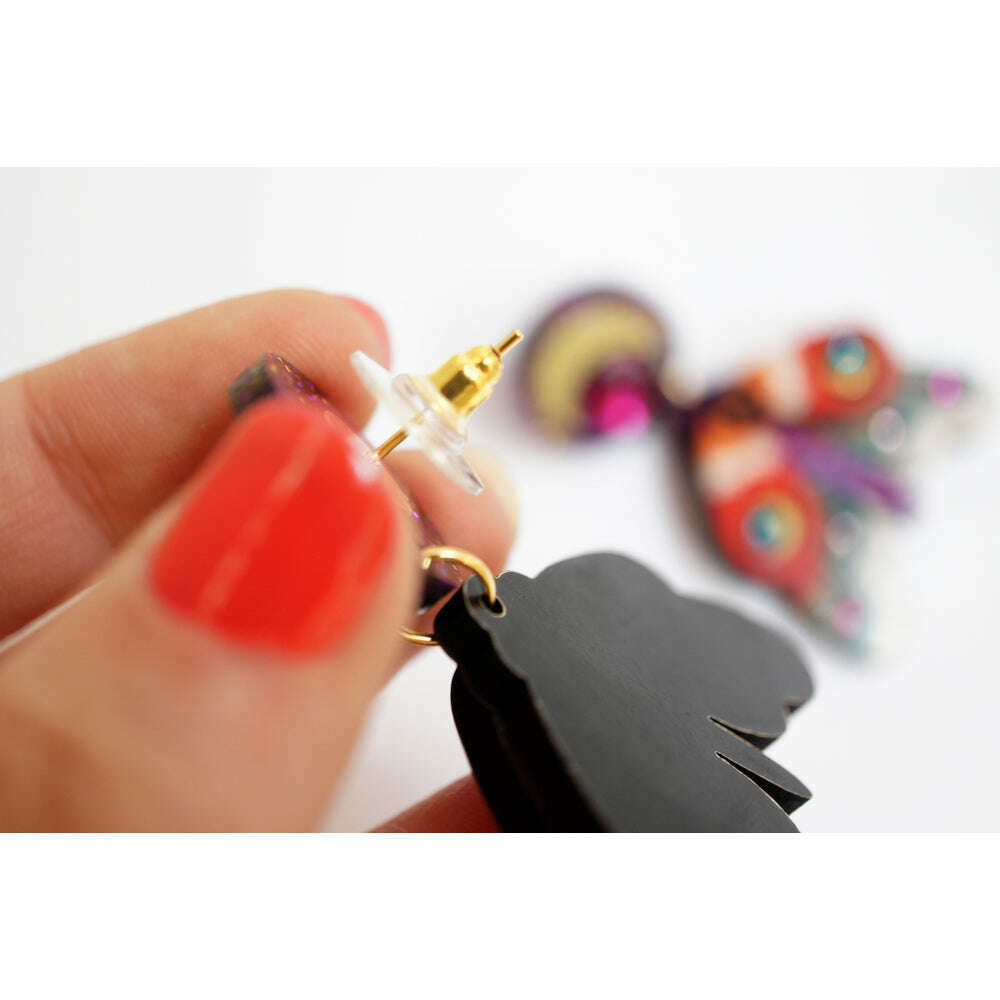 Black moth earrings with gold stud posts, colorful wing overlay and glitter purple cap