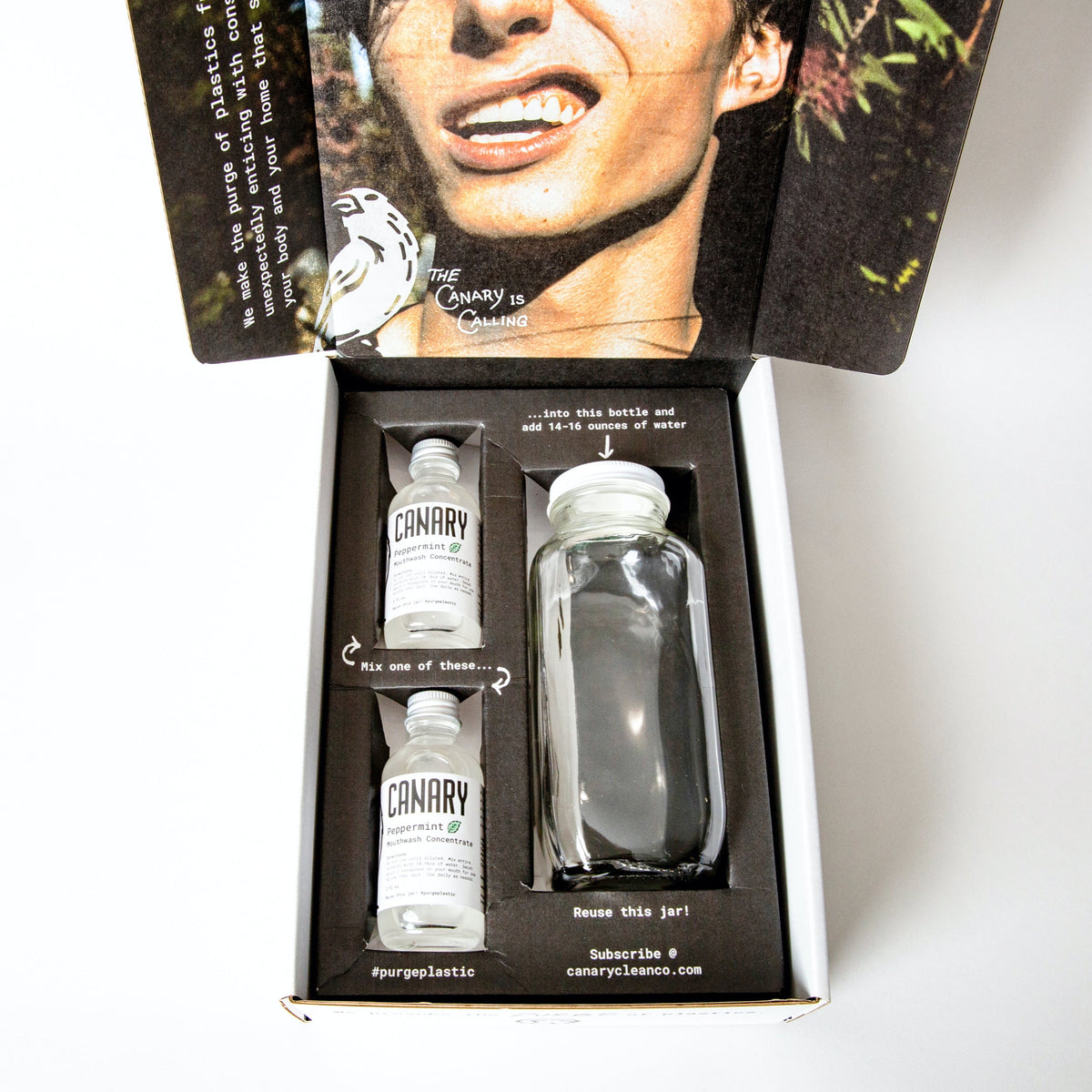 Canary mouthwash concentrate gift set with two small bottles and a reusable glass bottle