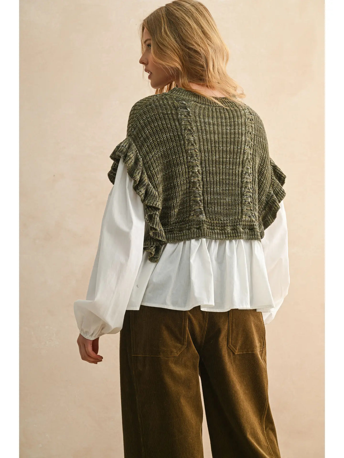 Sprig Top shown from the back, with an olive knit overlay and white blouse sleeves and hem