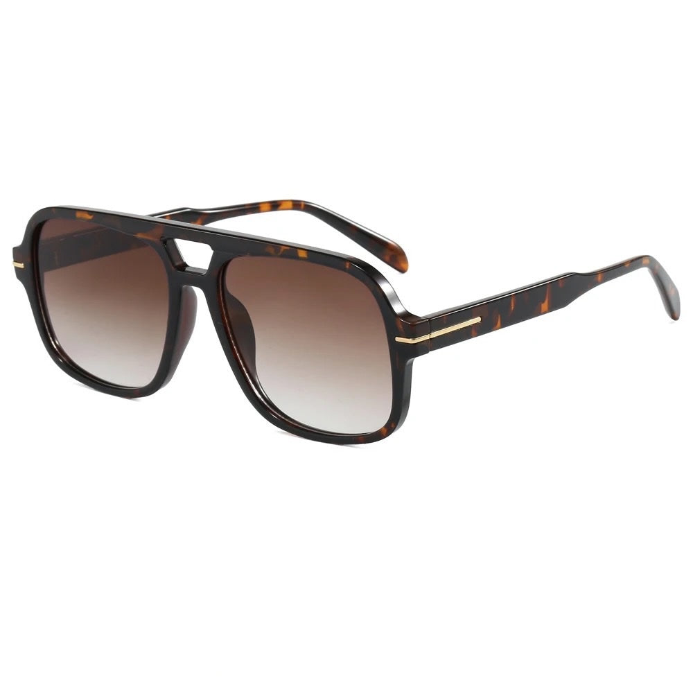 Oversized aviator sunglasses with dark tortoiseshell frame and brown gradient lenses