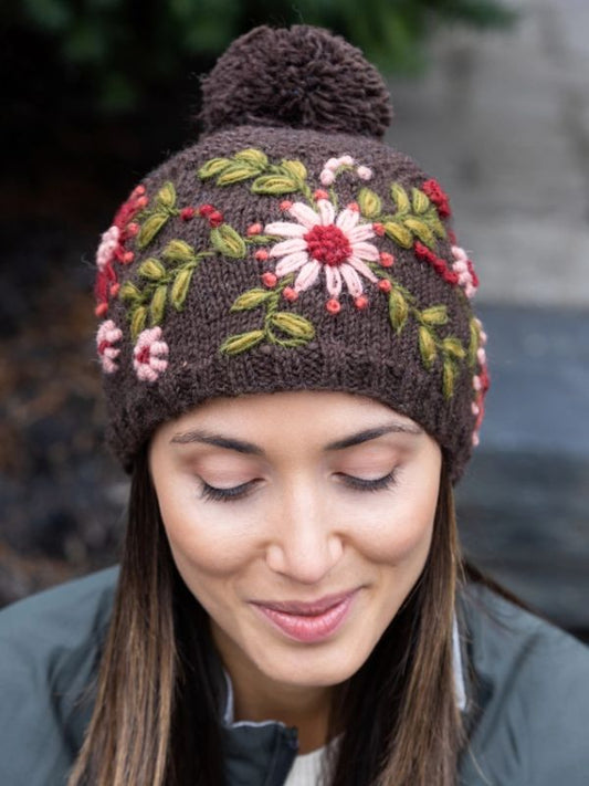 Wool knit embroidered hat in dark brown with pompom and floral stitching