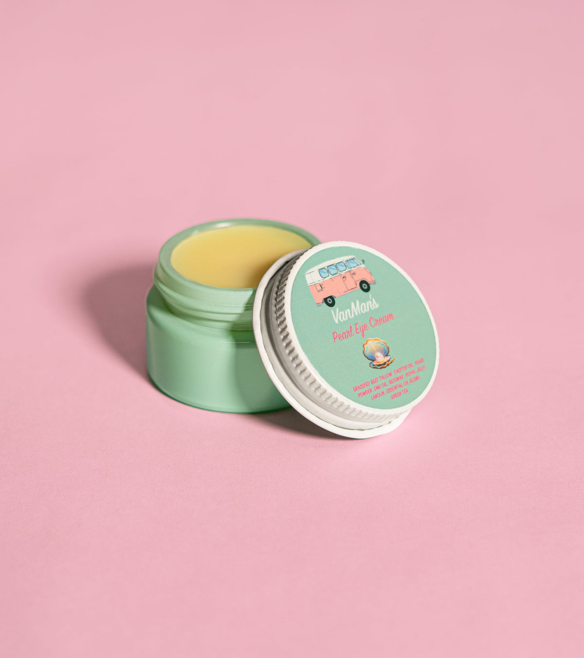 VanMan's Pearl eye cream jar with lid open, showing yellow cream inside