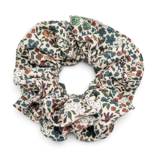 Floral fabric hair scrunchie with gathered ruffle and multicolor botanical print