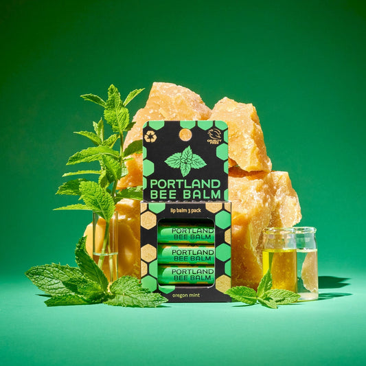 Lip balm pack with Oregon mint, shown with mint leaves and a small clear jar