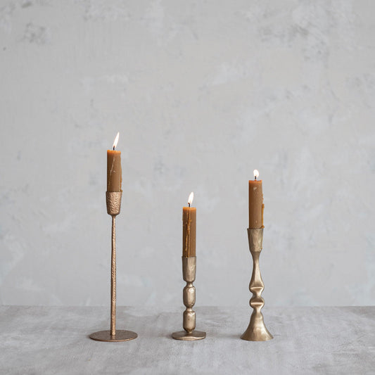 Antique gold metal taper holder set with candle sleeves