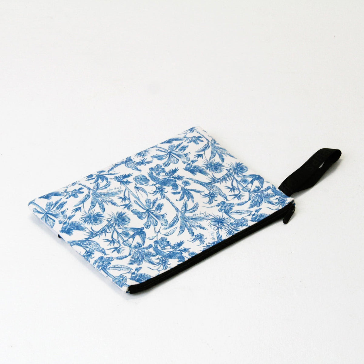Blue and white toile laptop sleeve, flat with black strap attached