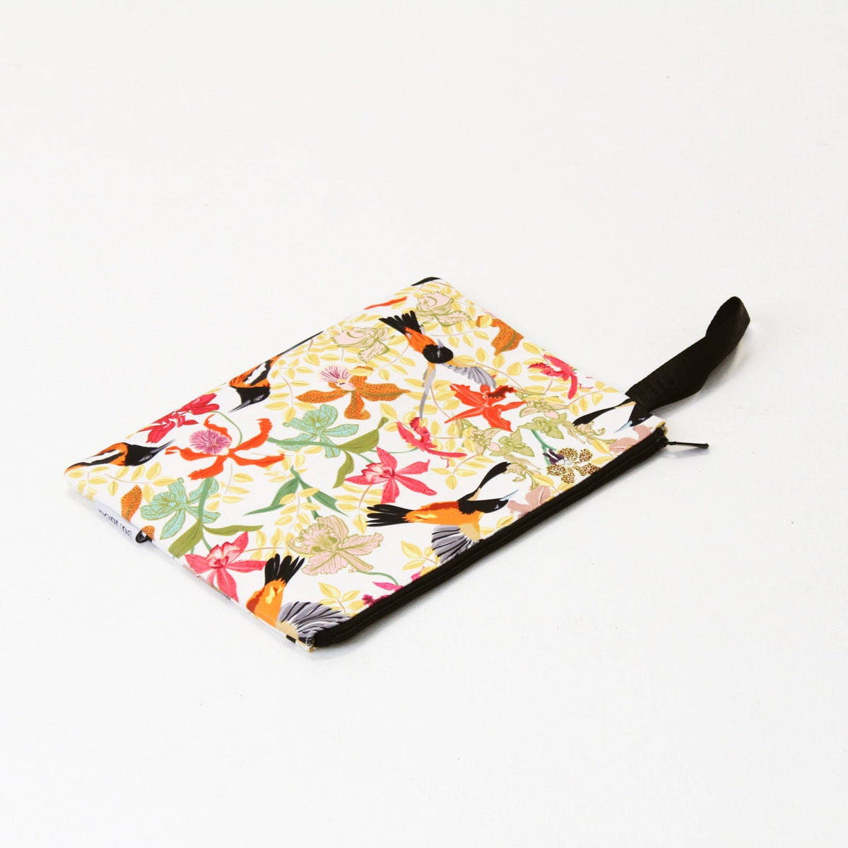 Tropical print laptop sleeve with black zipper and strap, laid flat