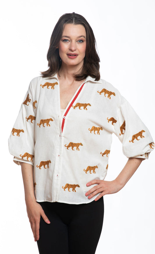 Ivory cheetah print blouse with red-trim V-neck and three-quarter balloon sleeves