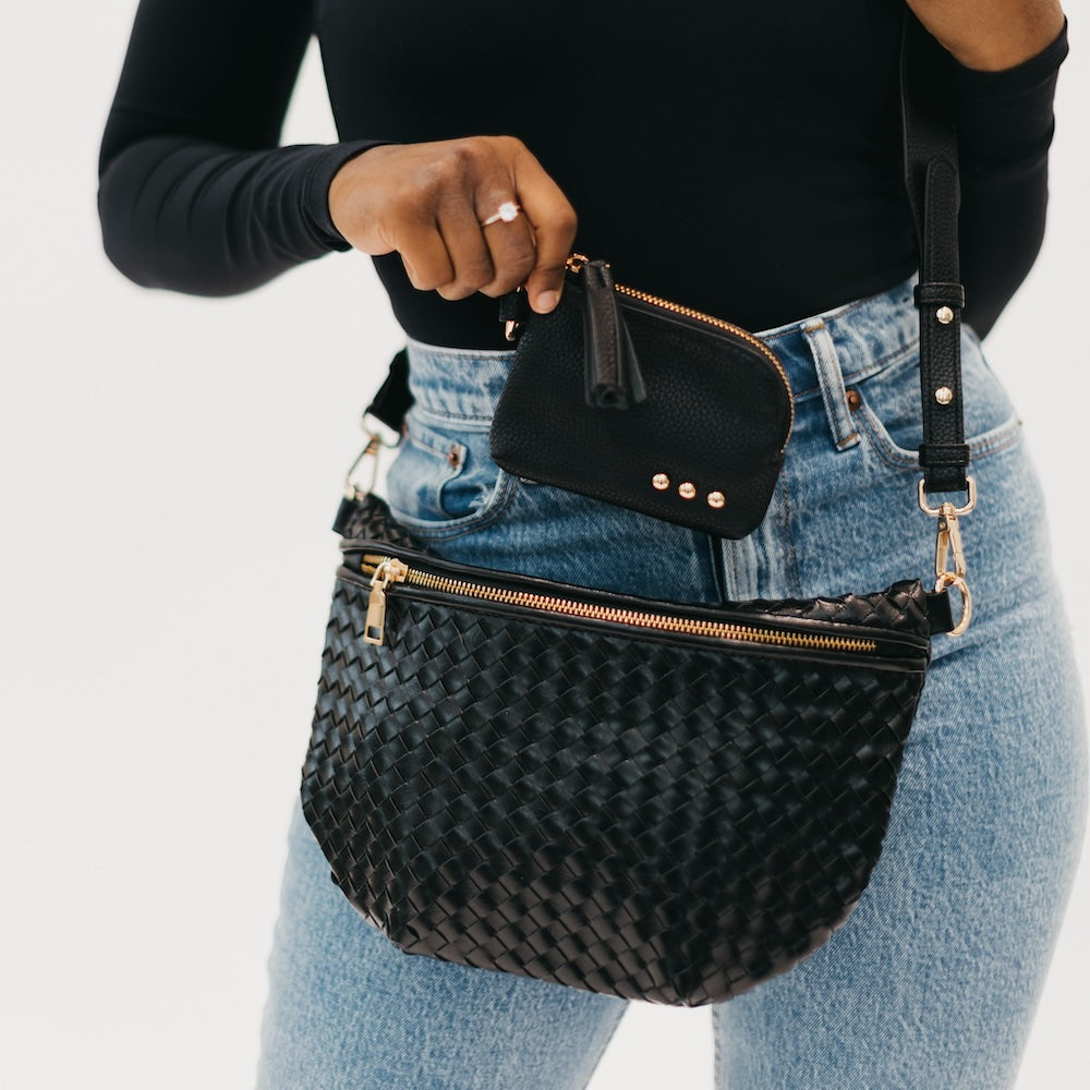 Black pebbled card wallet with gold zipper, key ring, and tassel.
