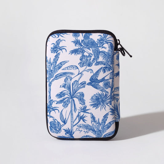 Blue toile passport wallet with black-edged zipper closure, front view