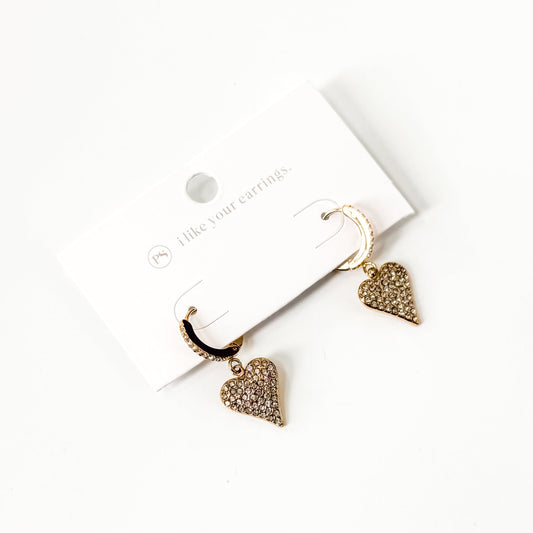 Gold and black huggie hoop earrings with pave heart charms