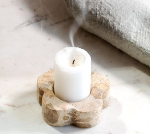 Beige marble flower tealight holder with lit white candle