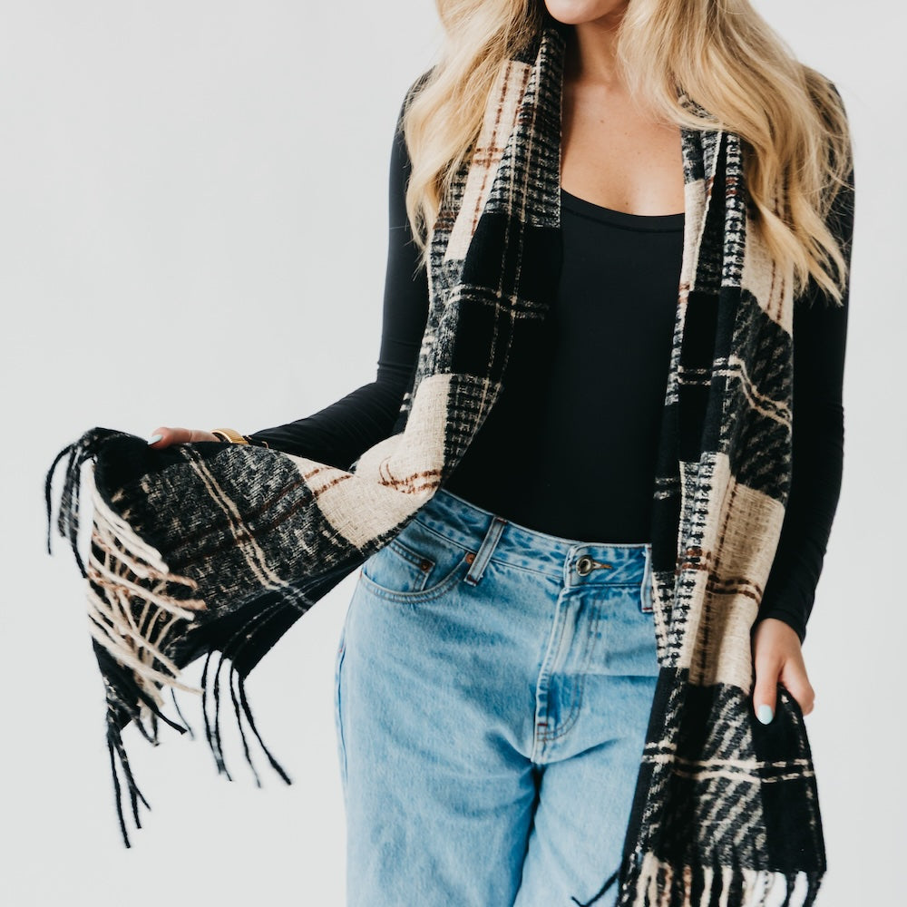Black and cream plaid scarf with fringe border and layered wrap