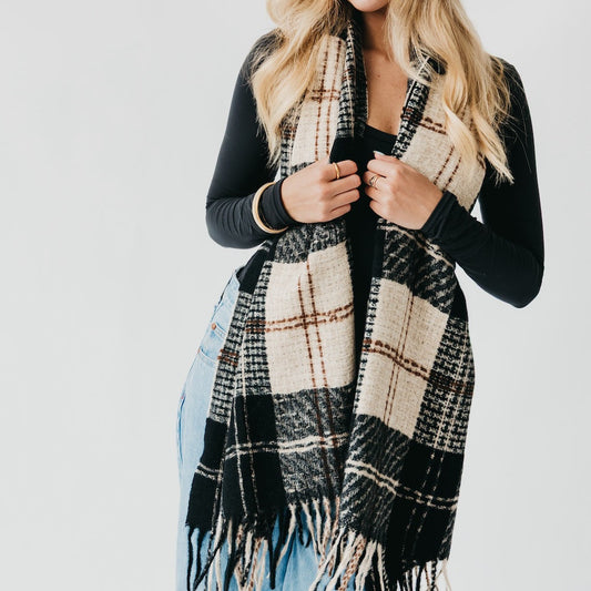 Black and cream plaid scarf with long fringe ends, draped open