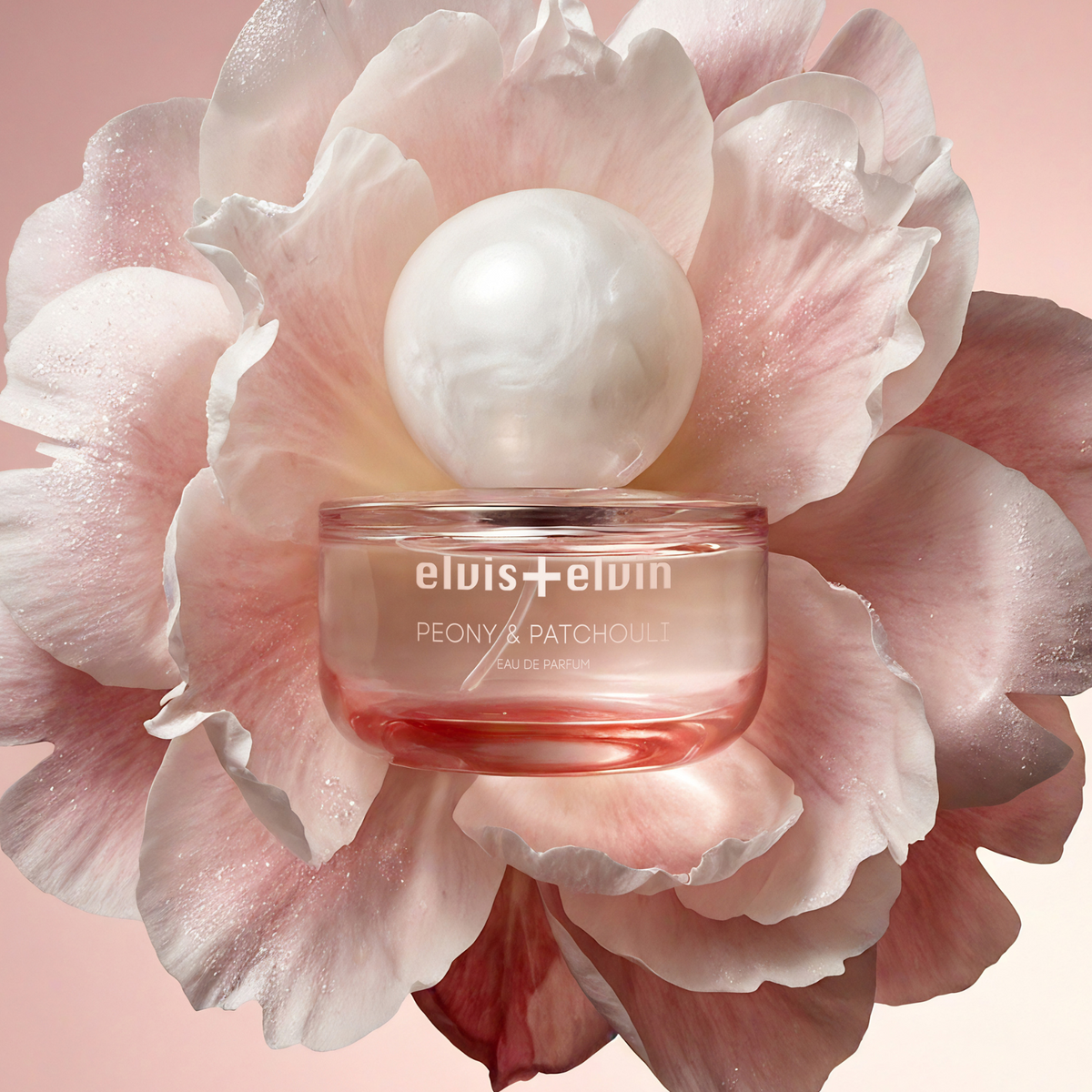 Peony & patchouli eau de parfum jar nestled in large pink flower petals