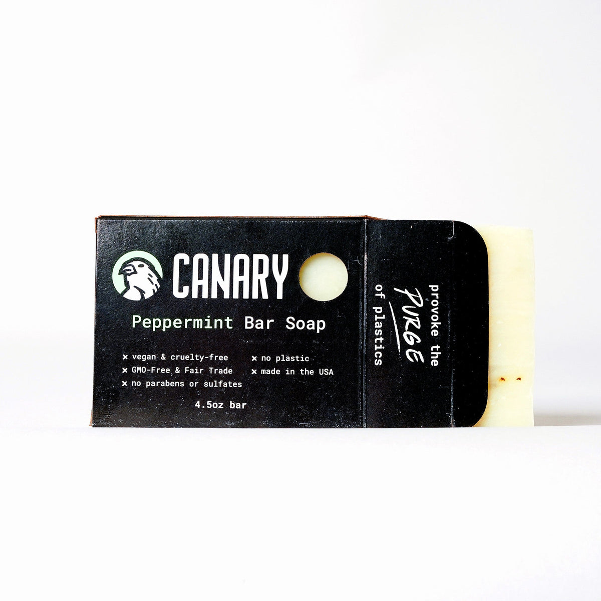 Peppermint bar soap in a black cardboard wrapper