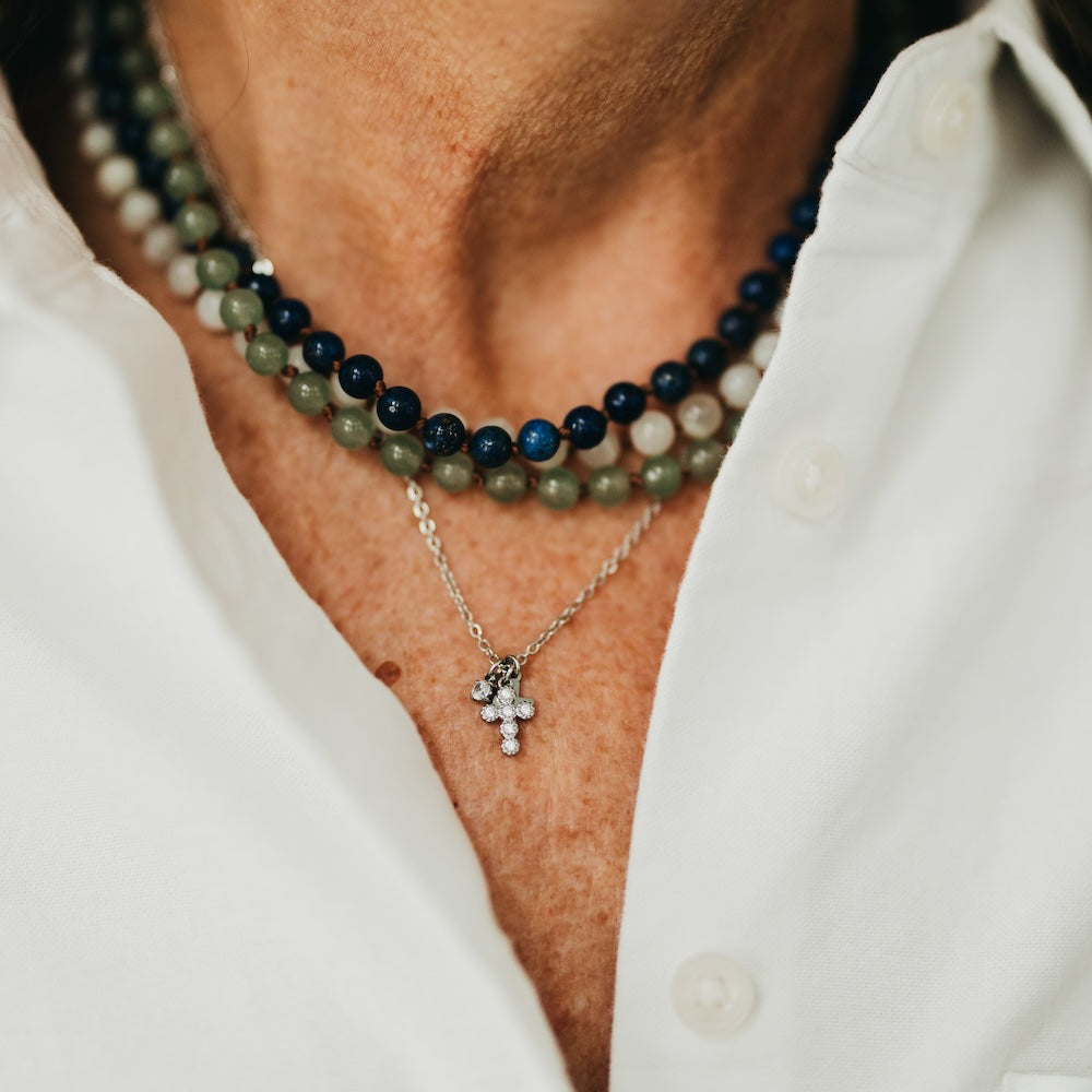 Petite double cross necklace with two cross charms on beaded strand, gold-tone and dark beads