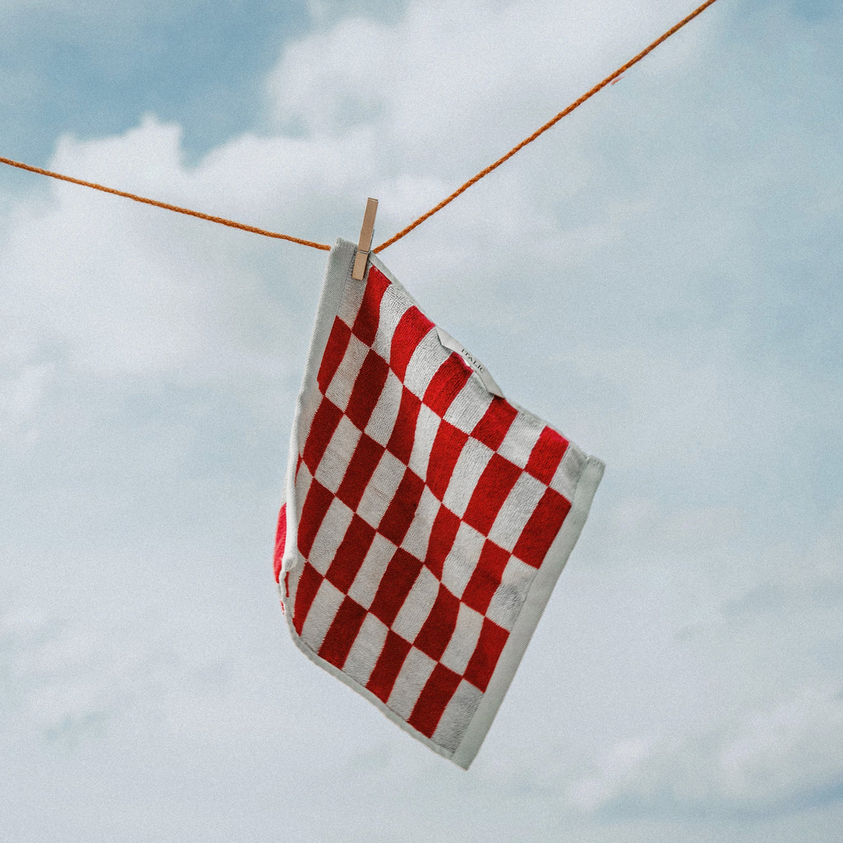 Hanging red and white checkered cotton towel