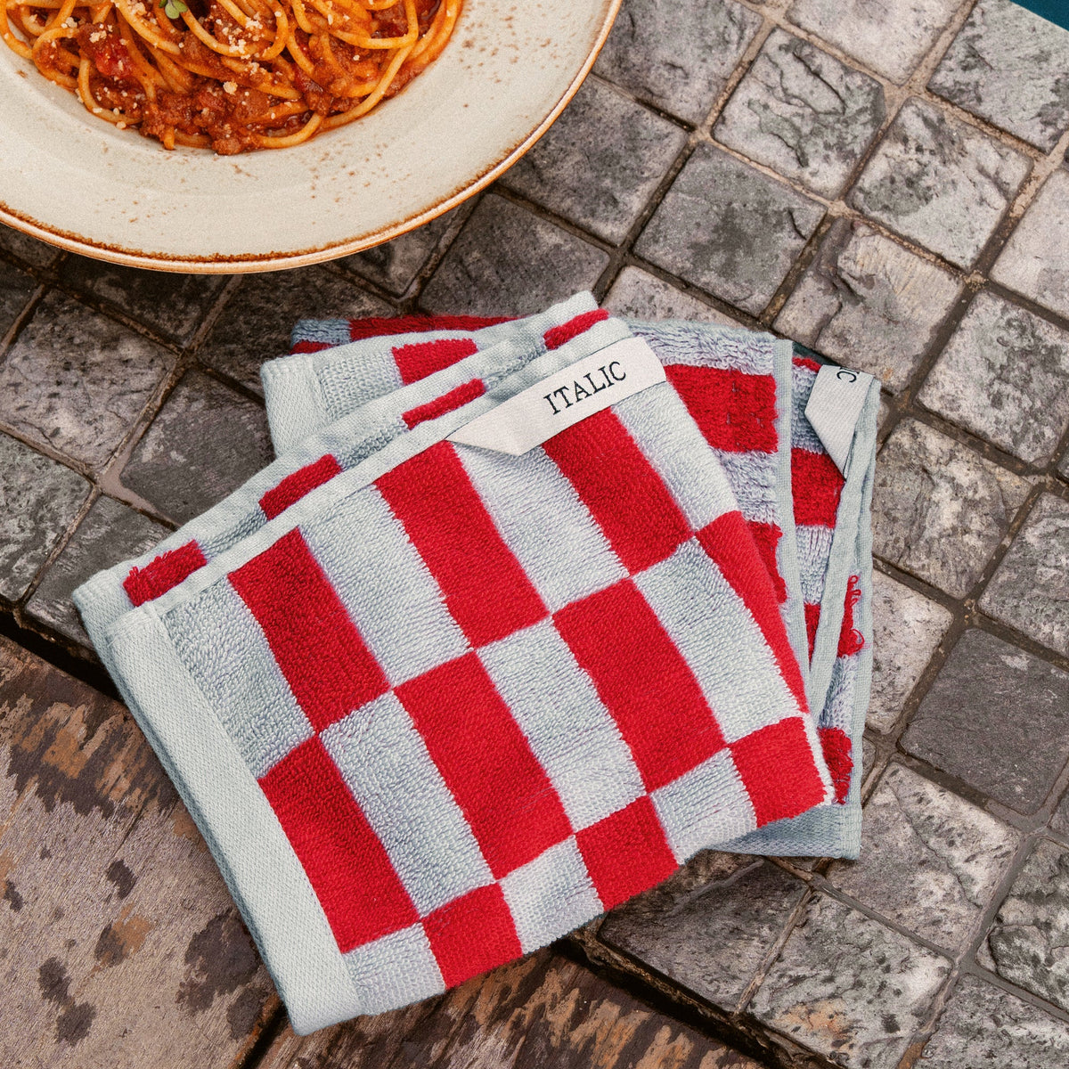 Folded red and white checkered cotton towels