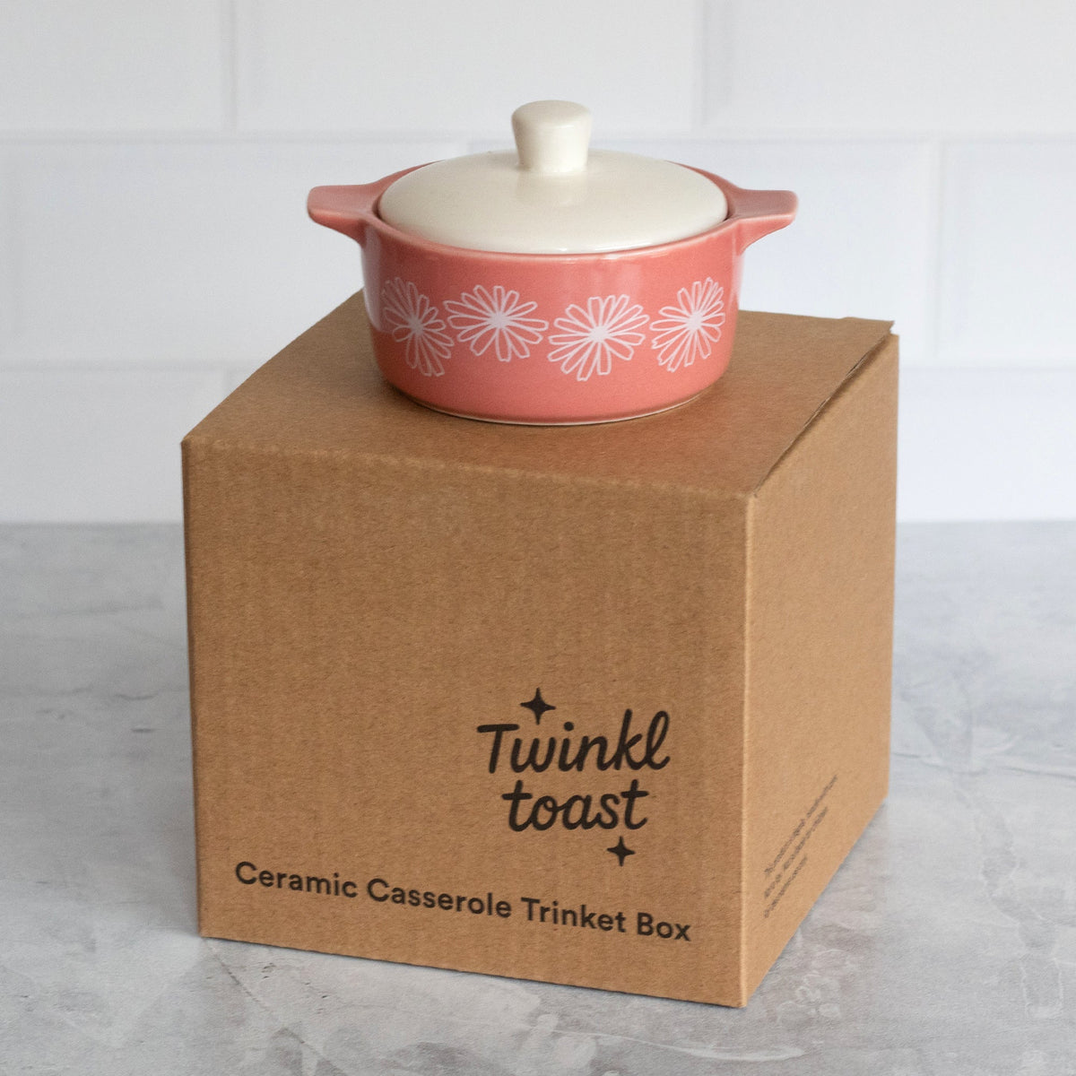 Pink ceramic casserole trinket box with white daisy pattern on Twinkle toast gift box