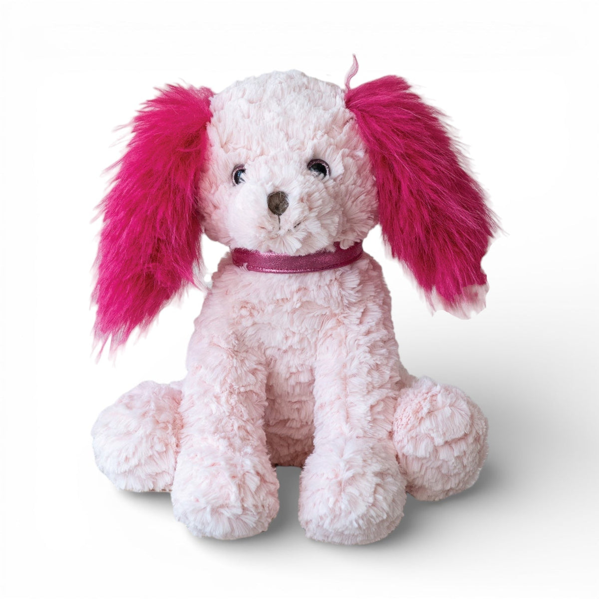 Pink and fuchsia plush dog with floppy ears and dark collar, seated
