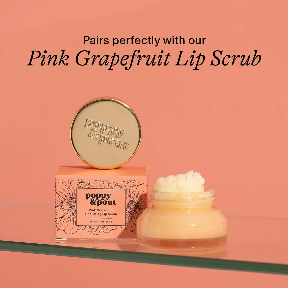 Pink grapefruit lip scrub jar and open balm container