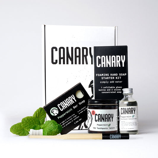Canary plastic-free bathroom kit with soap, toothpaste tablets, mouthwash, and hand soap supplies