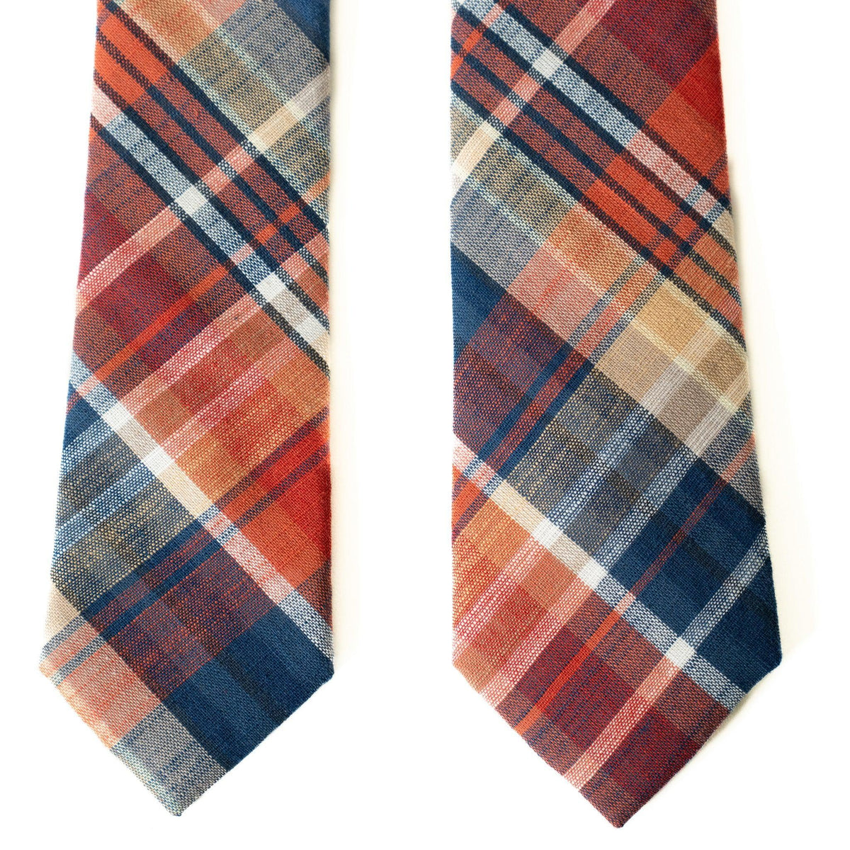 Set of two men's plaid neckties in rust orange and blue with white and tan grid