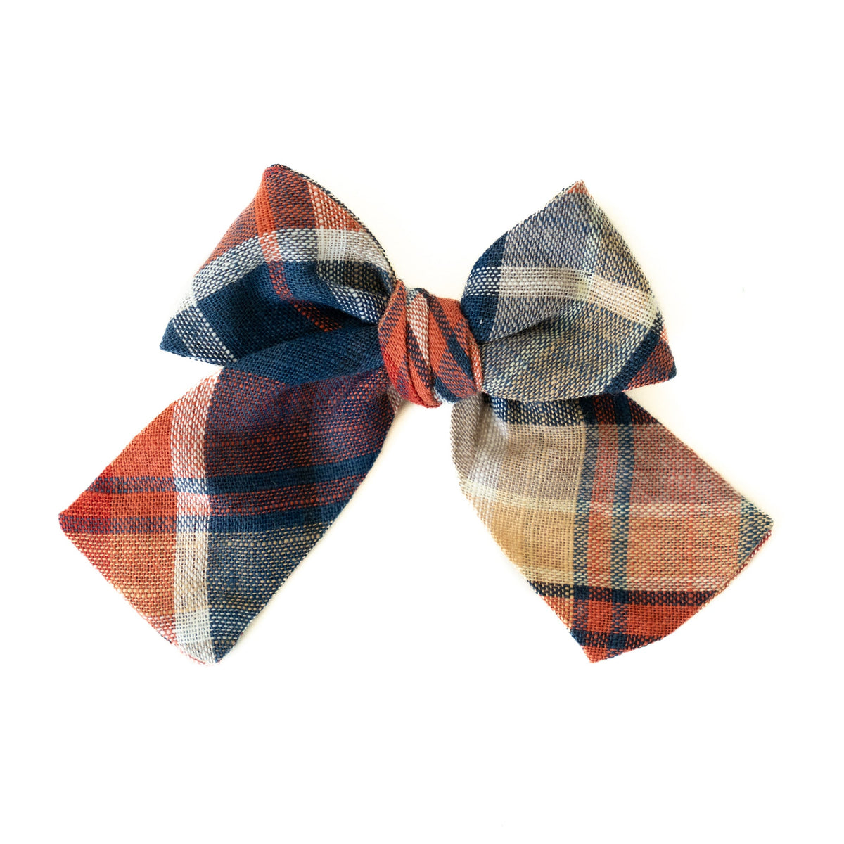 Petite plaid hair bow in orange, navy, and beige with woven check pattern